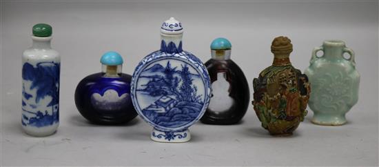 Six snuff bottles, two blue and white, two cameo glass and two ceramic